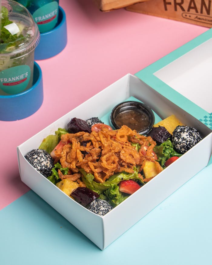 why-choose-us Colorful salad with unique dressing in stylish packaging, perfect for quick meals.