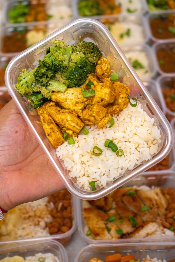 about-us Meal prep featuring chicken, broccoli, and rice in a container, perfect for healthy eating on-the-go.